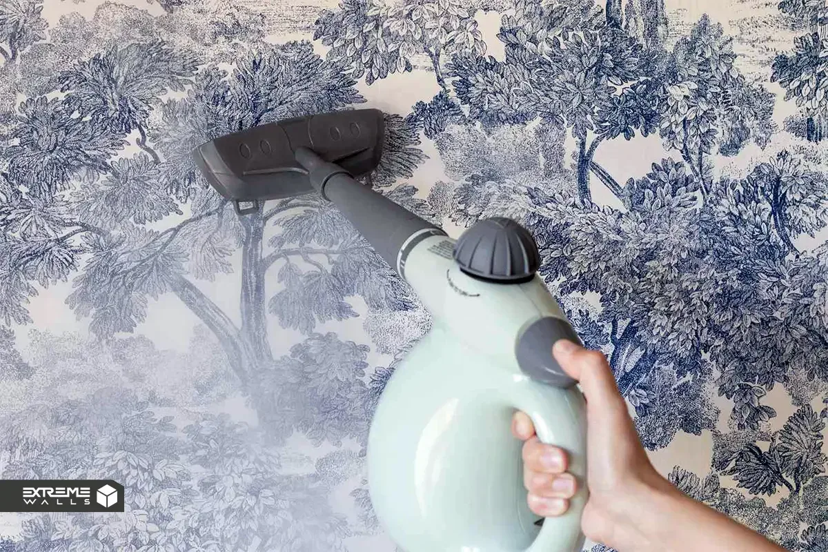 Removing wallpaper using a steamer to soften adhesive, making it easy to peel the wallpaper off the wall safely.