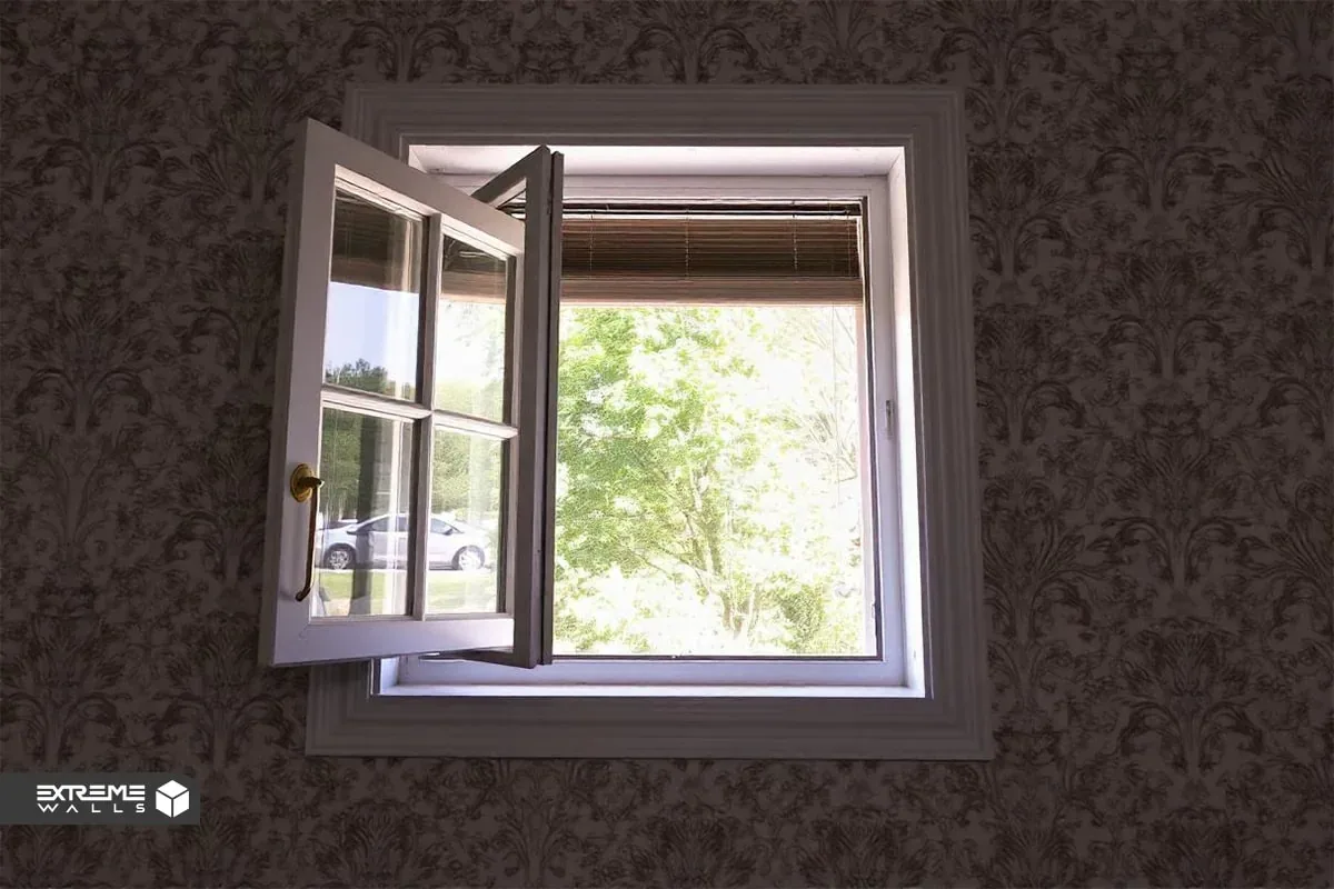 کاربردی ترین روش های ترمیم کاغذ دیواری پاره شده و آسیب دیده 8 دیوار با کاغذ دیواری که تازه چسبانده شده و در حال خشک شدن است